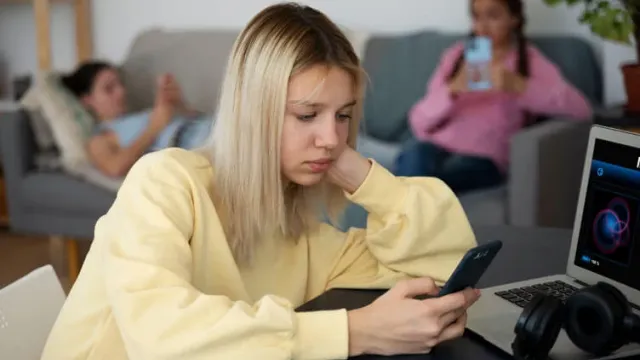 High angle girl holding smartphone